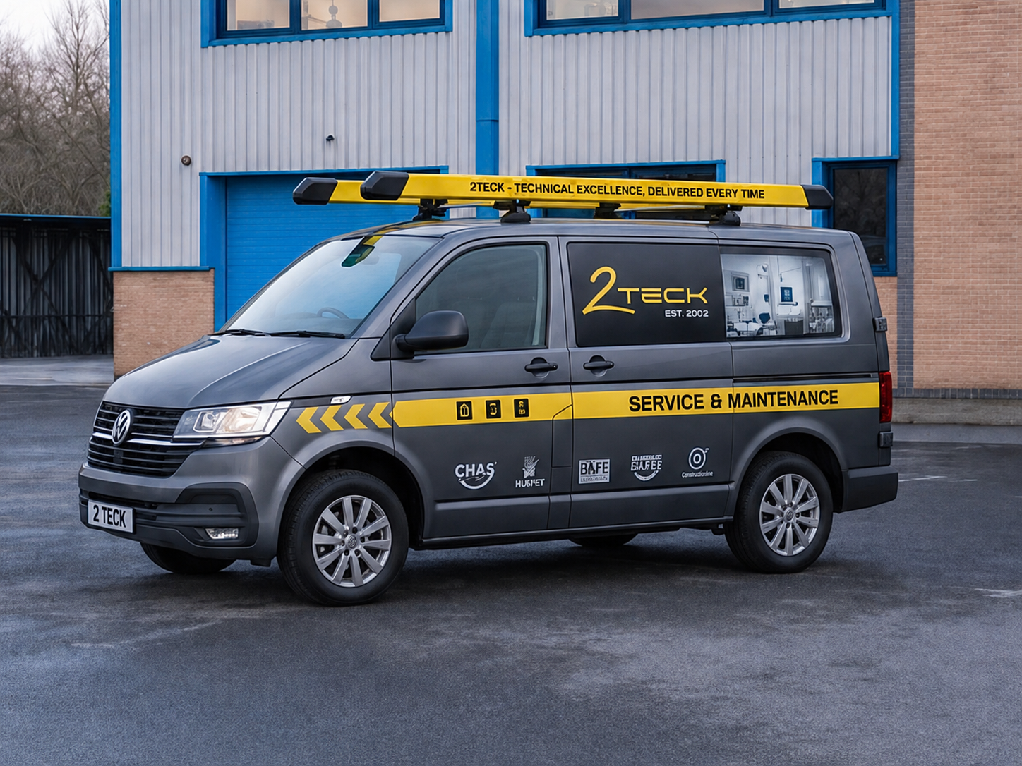 Grey service van with yellow Service & Maintenance livery