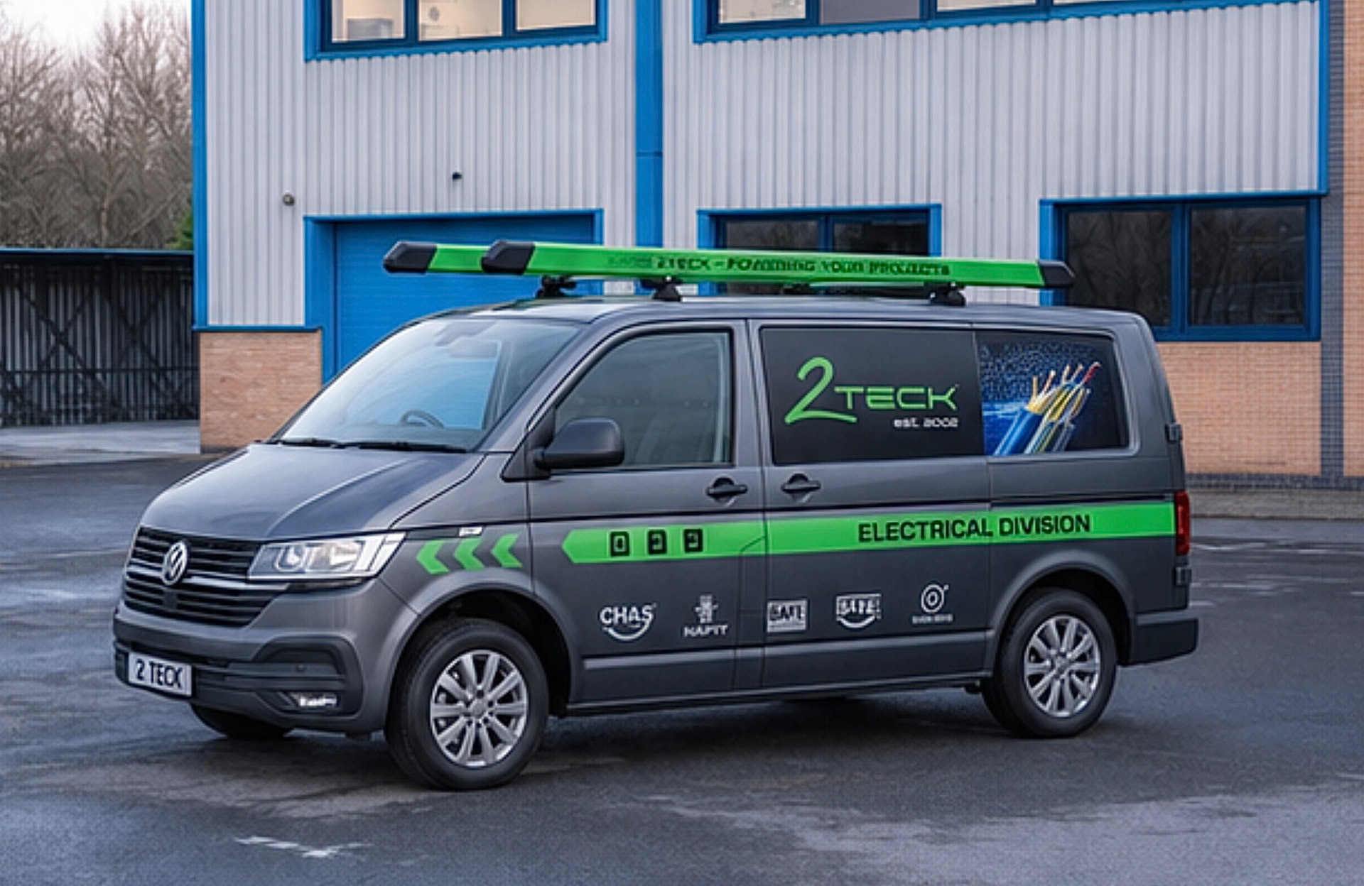 Grey service van with green electrical division livery