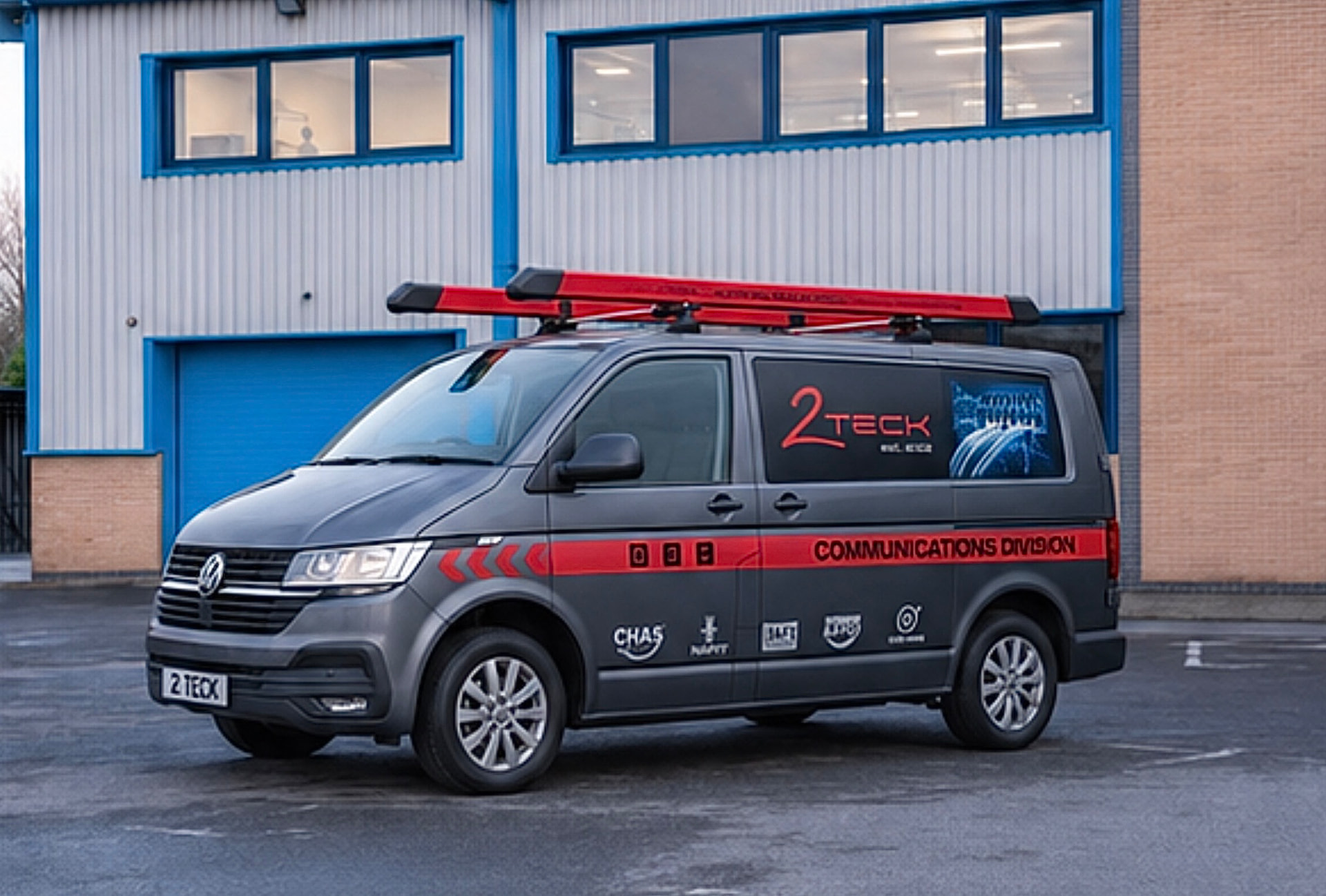 Grey service van with red communications division livery