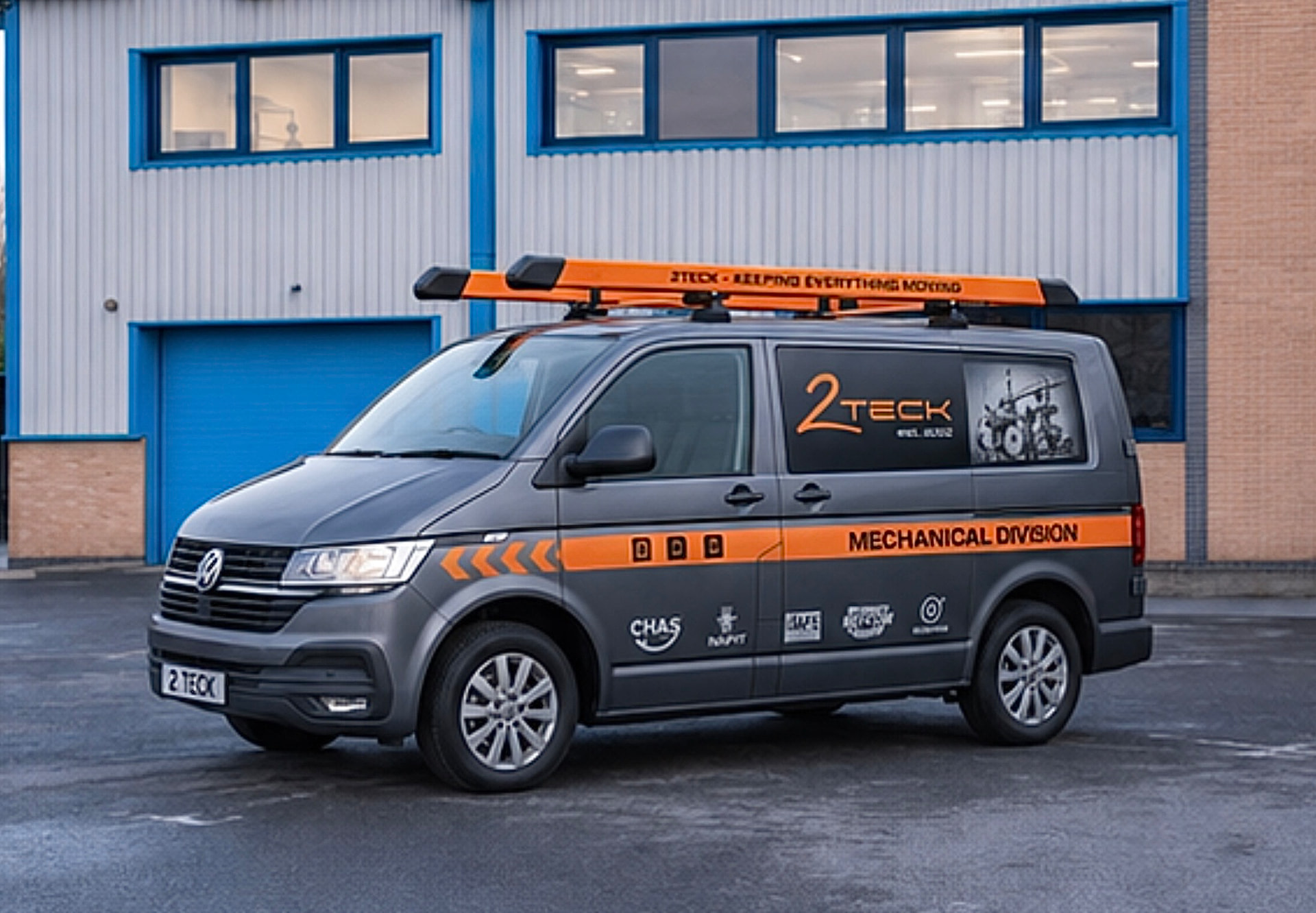 Grey service van with orange mechanical division livery